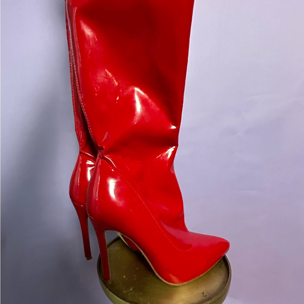 Thigh, high red boots